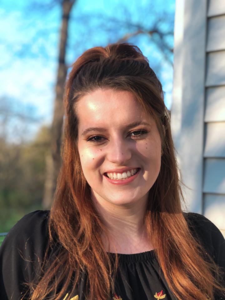 a portrait of a young woman smiling